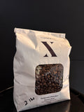 Bag of CoffeeX  Guatemala Whole Beans on a black background