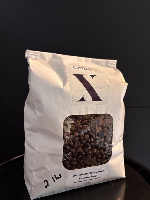 Bag of CoffeeX  Guatemala Whole Beans on a black background